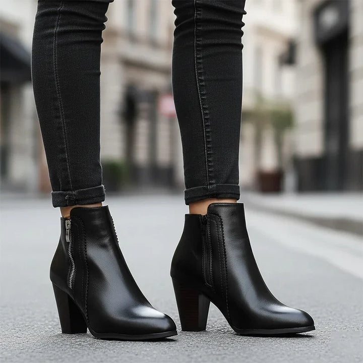 Women's ankle boots with side zippers and high block heels in black and brown