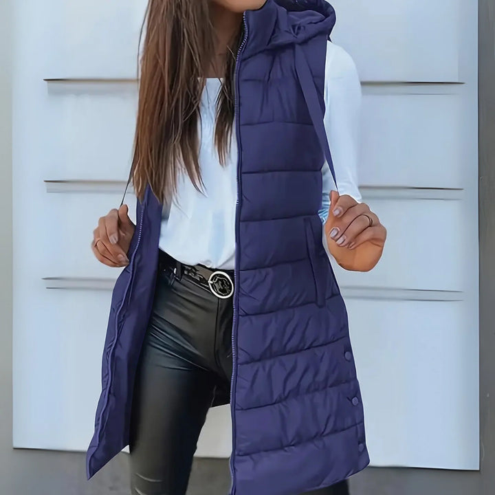 Women's long sleeveless hooded quilted puffer vest with zip front