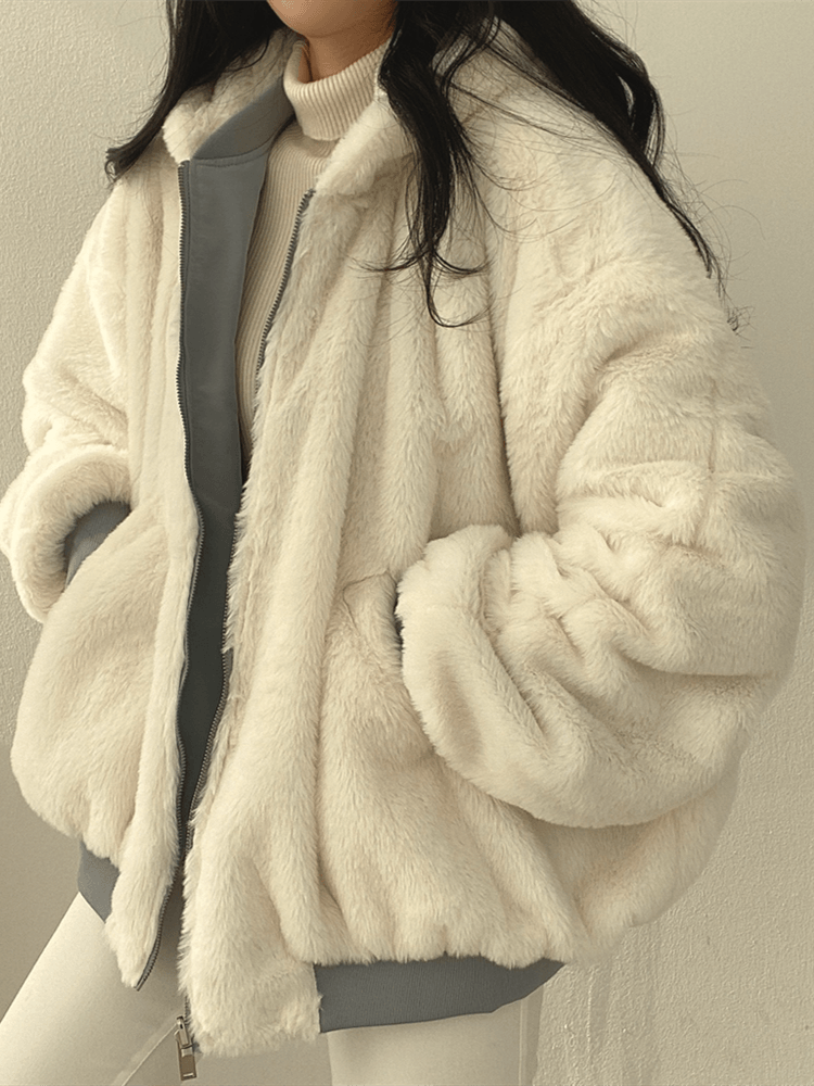 Women's reversible hooded jacket shown in black and blue with plush lining