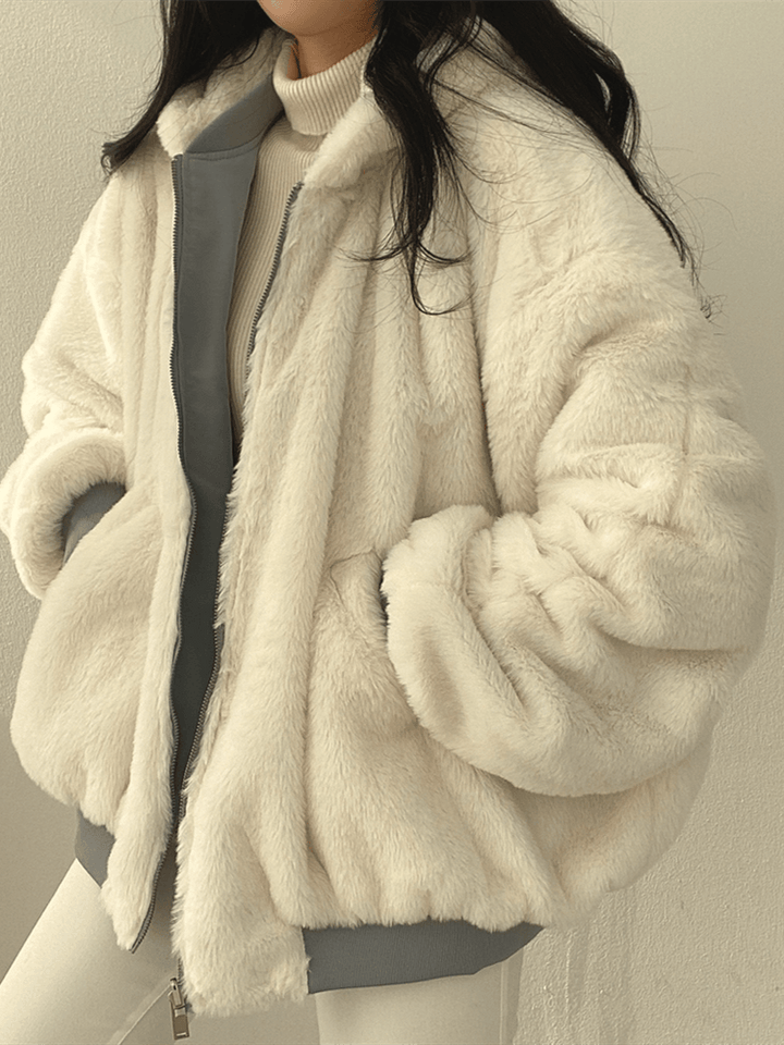 Women's reversible hooded jacket shown in black and blue with plush lining