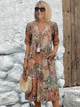 Women's vibrant mosaic pattern midi dress with V-neck and three-quarter sleeves, shown in red and teal