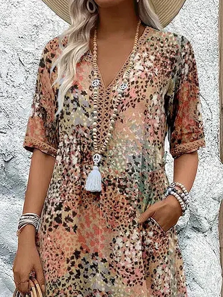 Women's vibrant mosaic pattern midi dress with V-neck and three-quarter sleeves, shown in red and teal