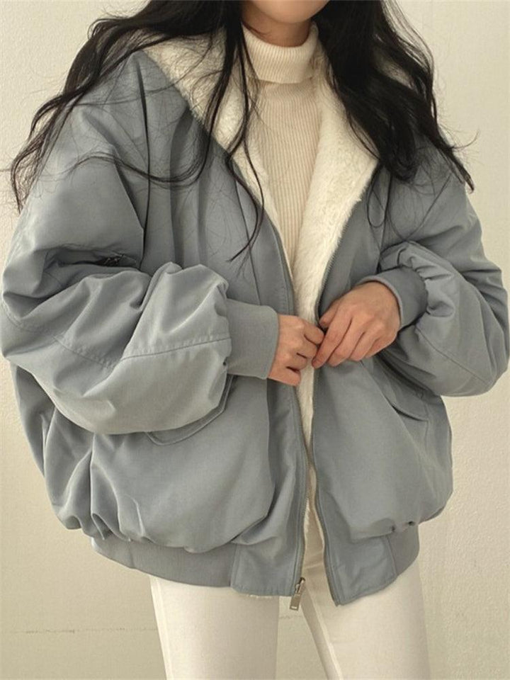 Women's reversible hooded jacket shown in black and blue with plush lining