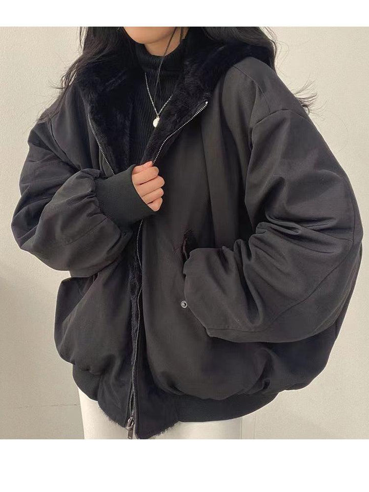 Women's reversible hooded jacket shown in black and blue with plush lining