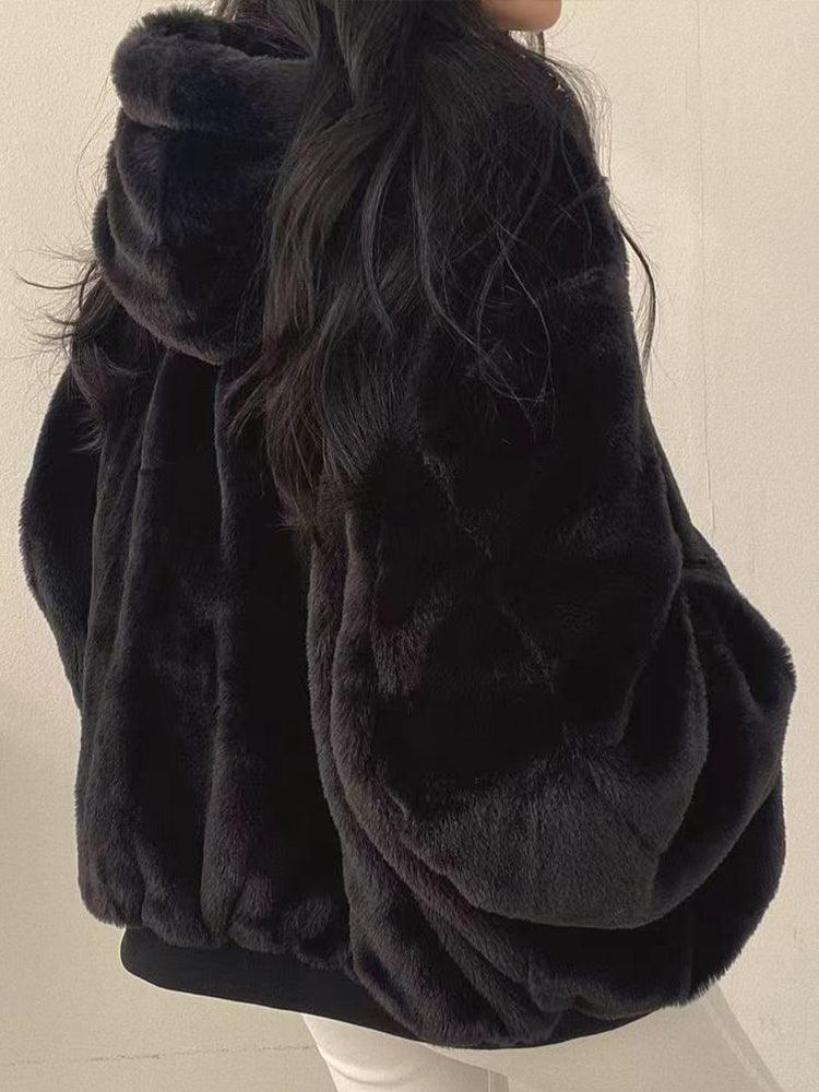 Women's reversible hooded jacket shown in black and blue with plush lining