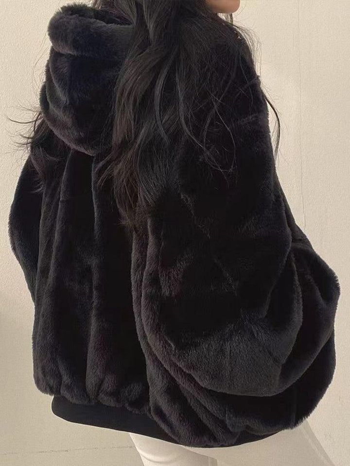 Women's reversible hooded jacket shown in black and blue with plush lining