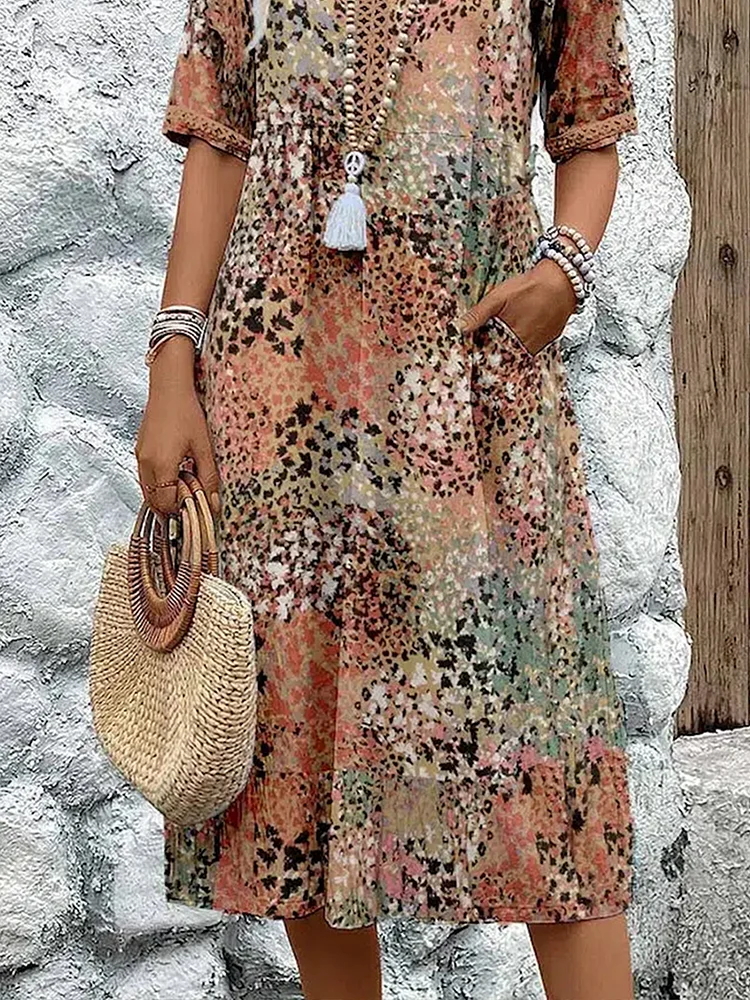 Women's vibrant mosaic pattern midi dress with V-neck and three-quarter sleeves, shown in red and teal