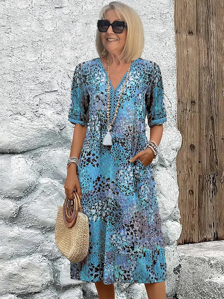 Women's vibrant mosaic pattern midi dress with V-neck and three-quarter sleeves, shown in red and teal
