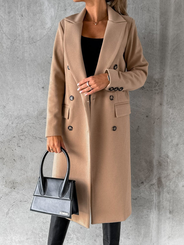Women's long double-breasted coat with lapels and flap pockets