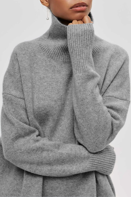 Women's oversized turtleneck sweater with ribbed trims and three-quarter sleeves