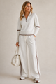 Women's zip sweater and wide-leg trouser set with contrast stripes