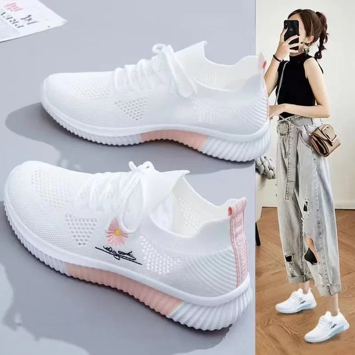 Women's textured lace-up sneakers with floral side detail and ridged soles