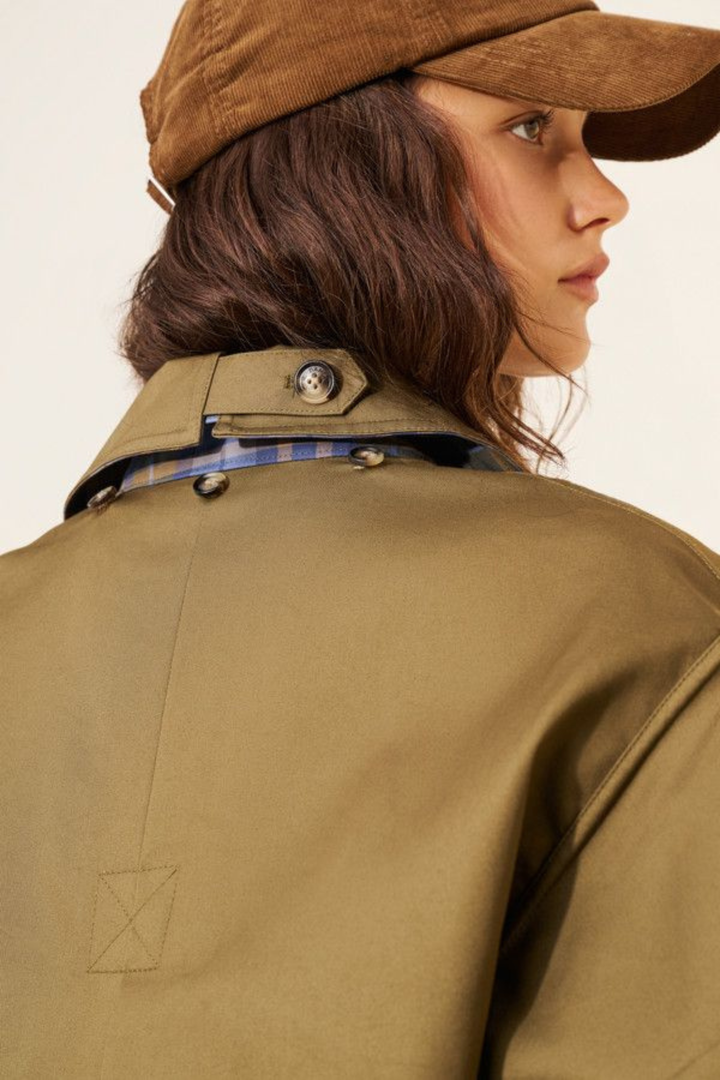 Women's olive utility jacket with blue plaid panels and long sleeves