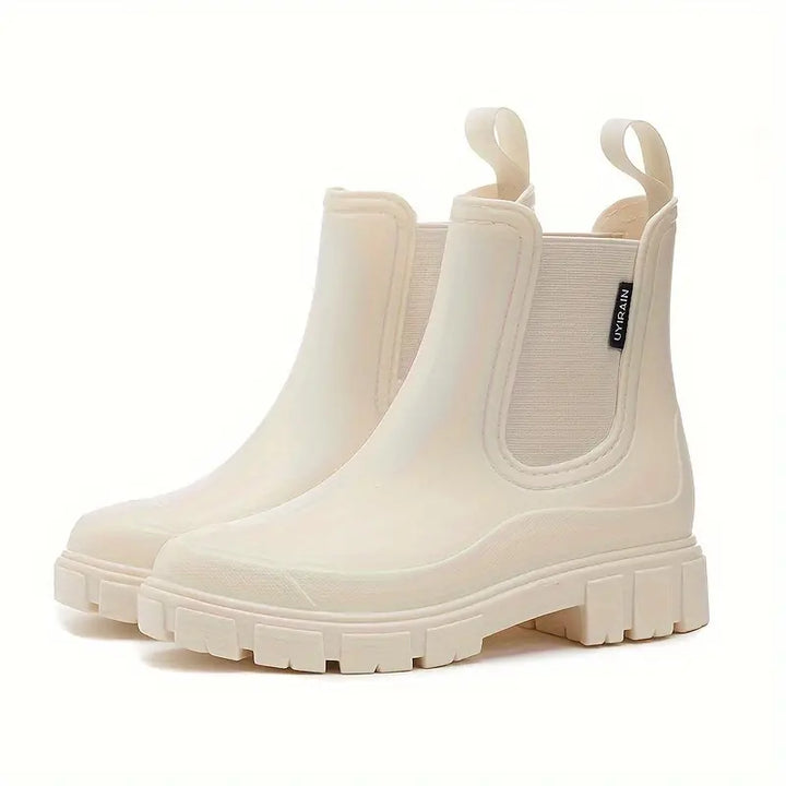 Women's slip-on Chelsea boots with elastic sides and lug soles