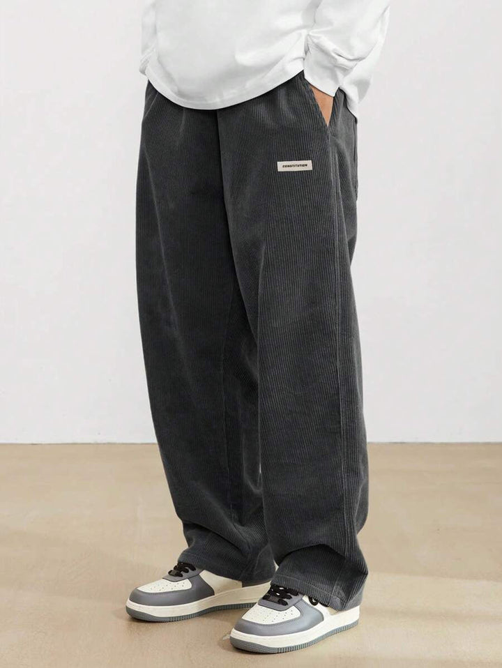 Men's wide-leg ribbed trousers with side pockets and long straight legs