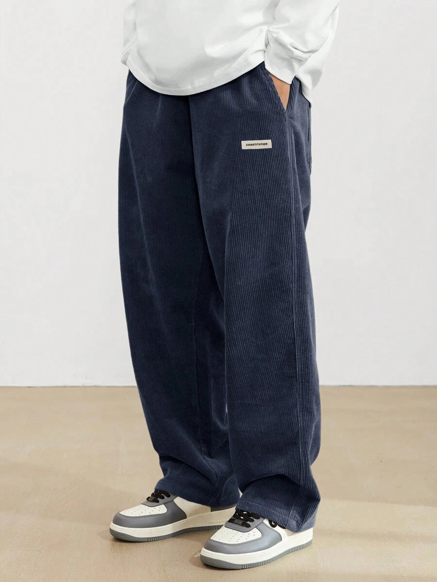 Men's wide-leg ribbed trousers with side pockets and long straight legs