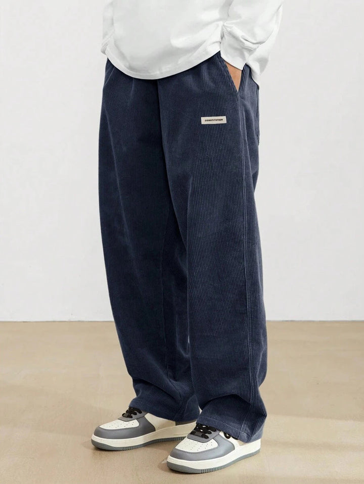 Men's wide-leg ribbed trousers with side pockets and long straight legs
