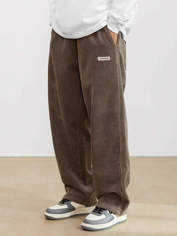 Men's wide-leg ribbed trousers with side pockets and long straight legs