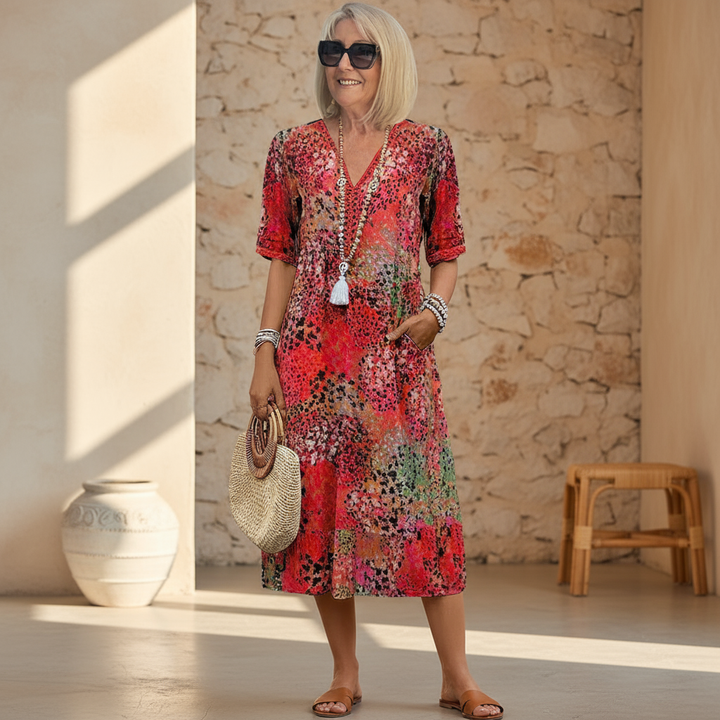 Women's vibrant mosaic pattern midi dress with V-neck and three-quarter sleeves, shown in red and teal