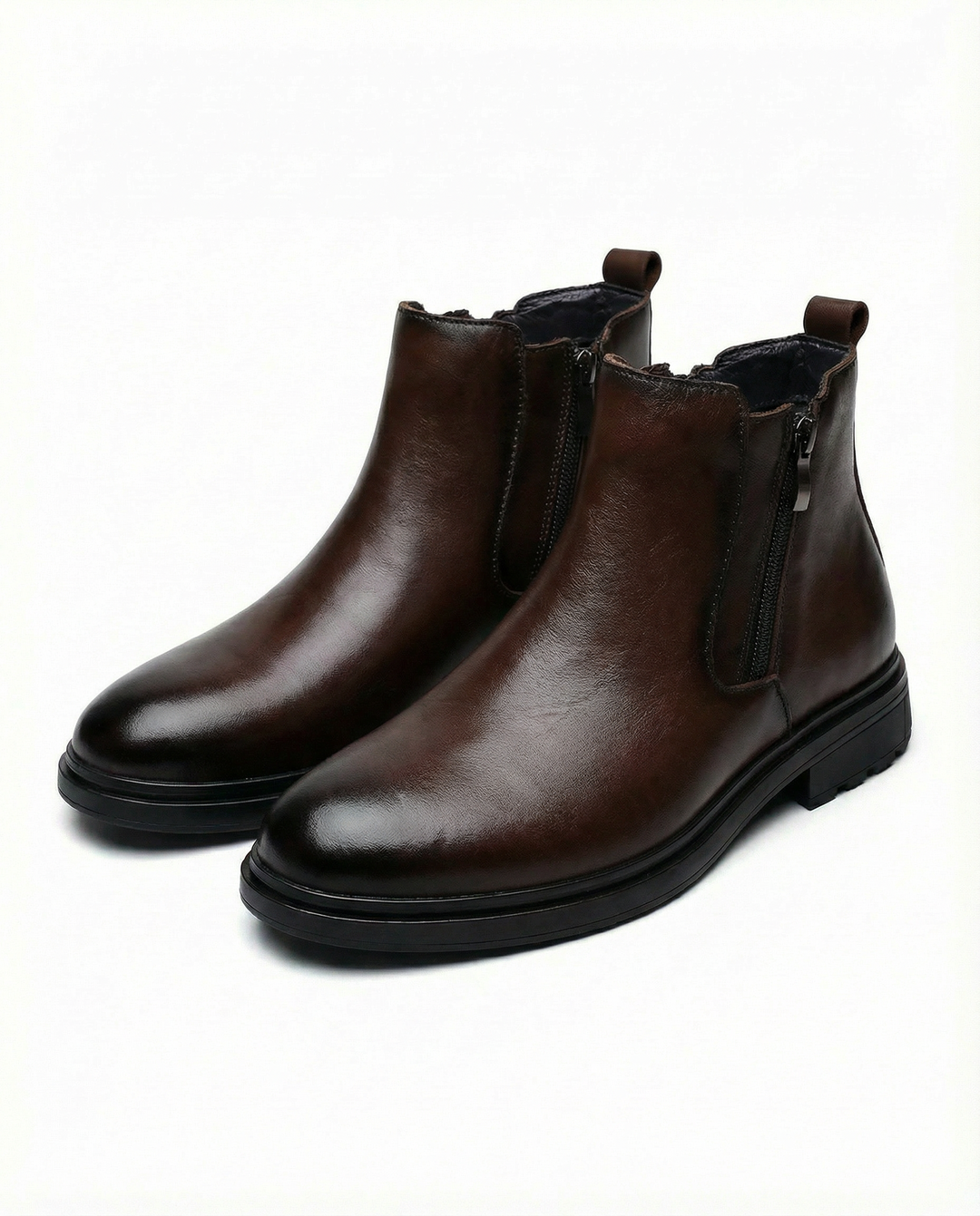 Ankle boots with side zippers, rounded toes, low heels and rear pull tabs