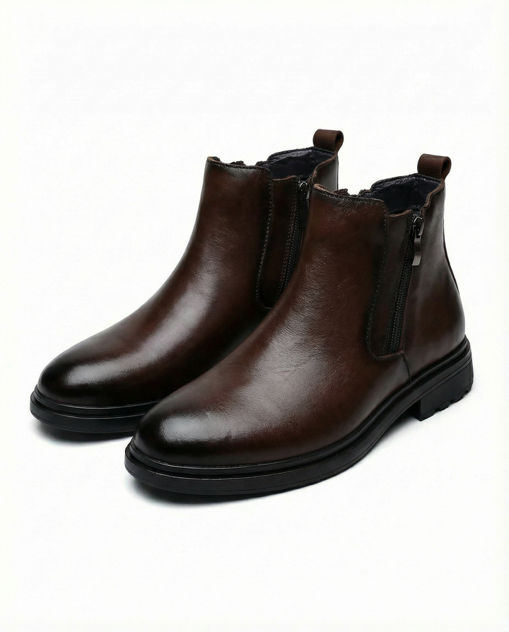 Ankle boots with side zippers, rounded toes, low heels and rear pull tabs