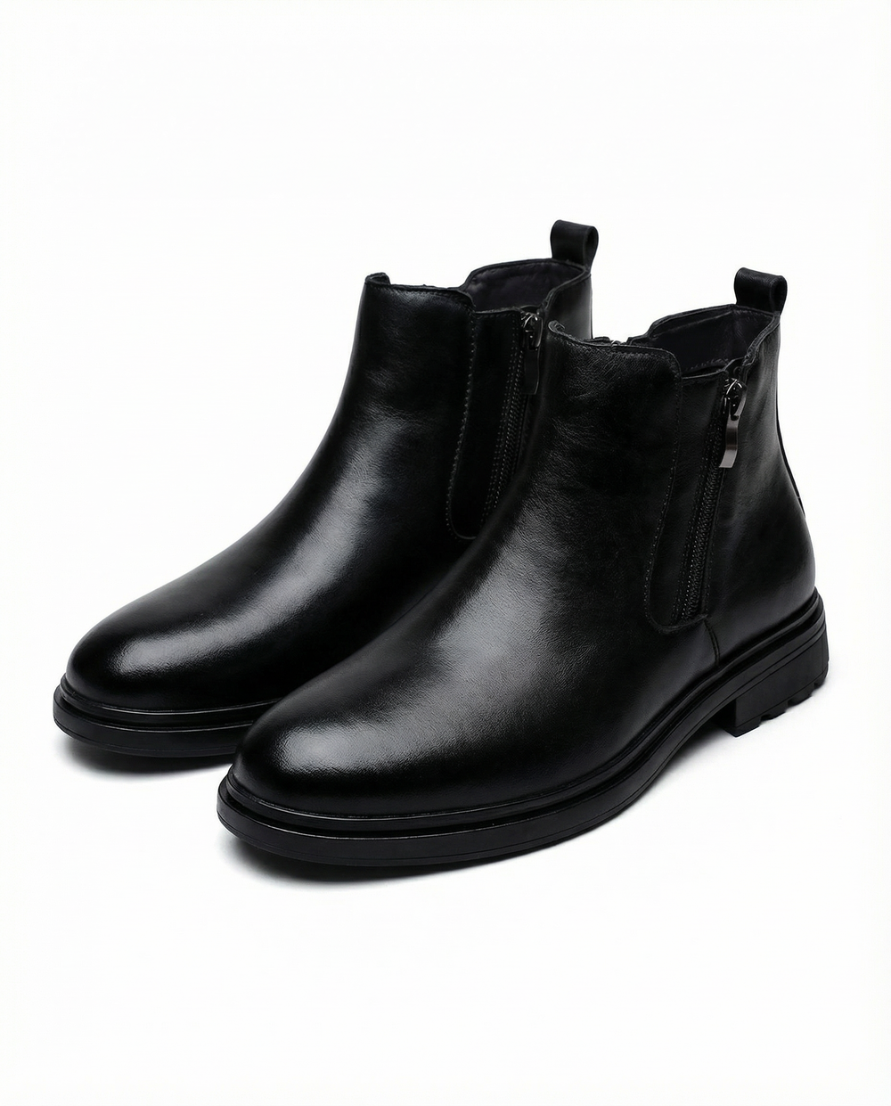 Ankle boots with side zippers, rounded toes, low heels and rear pull tabs