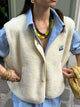 Women's sleeveless button-front vest with V-neckline and textured finish