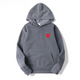Women's pullover hoodie with hood, long sleeves, kangaroo pocket and small heart graphic