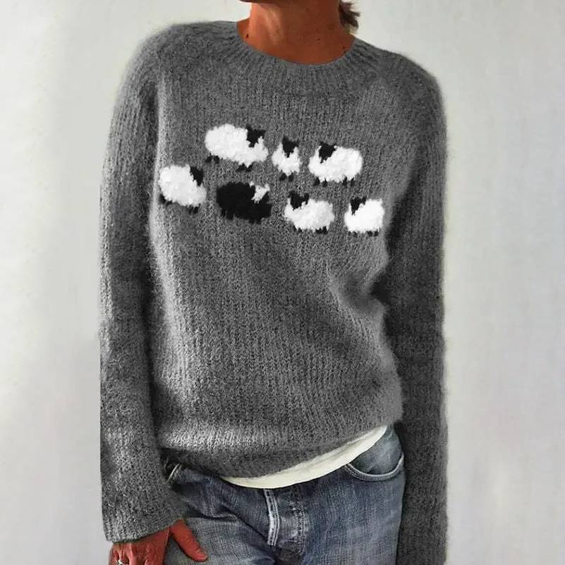 Gray knit sweater with a black and white abstract chest motif