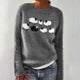 Gray knit sweater with a black and white abstract chest motif