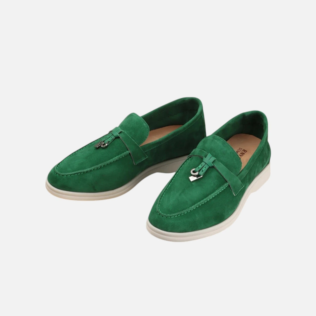 Men's textured slip-on loafers with flat soles, stitched apron detail and decorative toggle trim