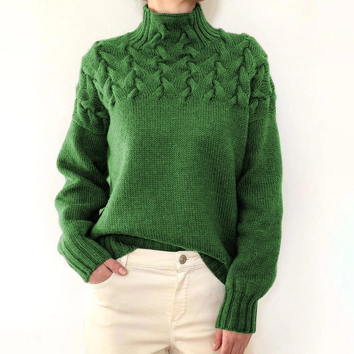 Women's cable knit turtleneck sweater with long sleeves and ribbed trims