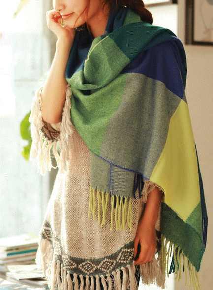 Oversized fringed scarf shown draped around the neck in checked and plain variations