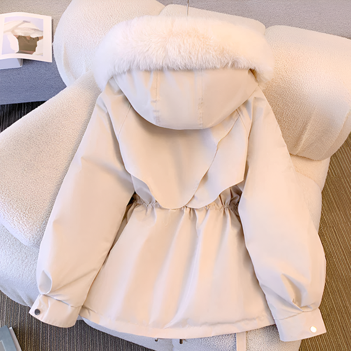 Women's hooded winter coat with fluffy trimmed hood and drawstring waist