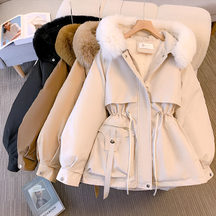 Women's hooded winter coat with fluffy trimmed hood and drawstring waist