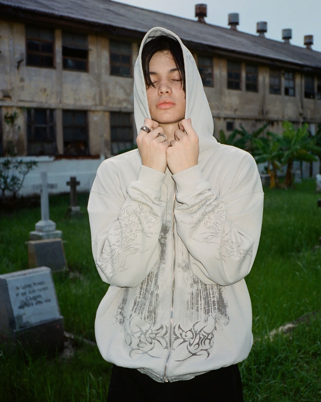 Light coloured zip up hoodie with cathedral graphic print and hood