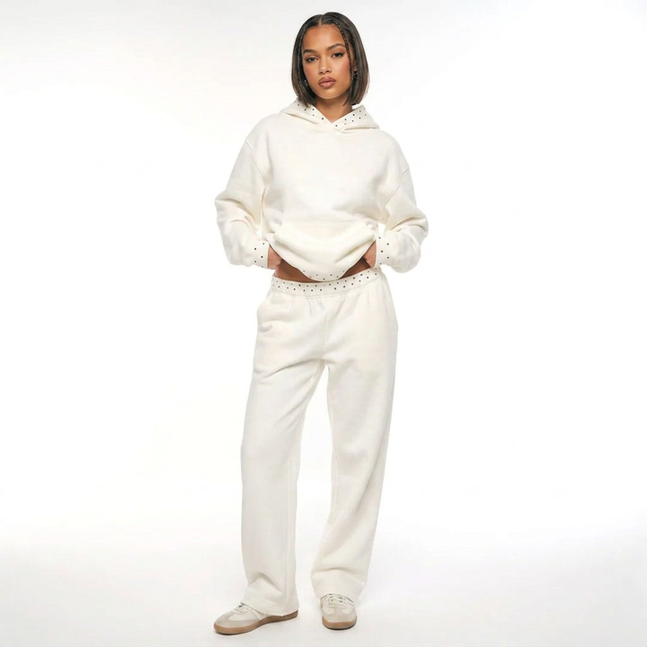 Women's white hooded sweatshirt and wide-leg trouser set with dotted trim