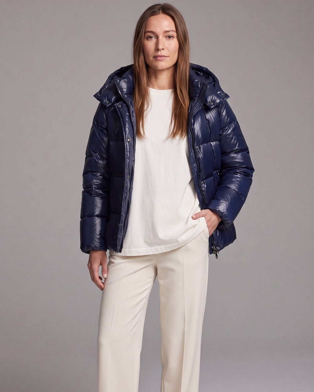 Women's hooded quilted puffer coat with long sleeves and zip front