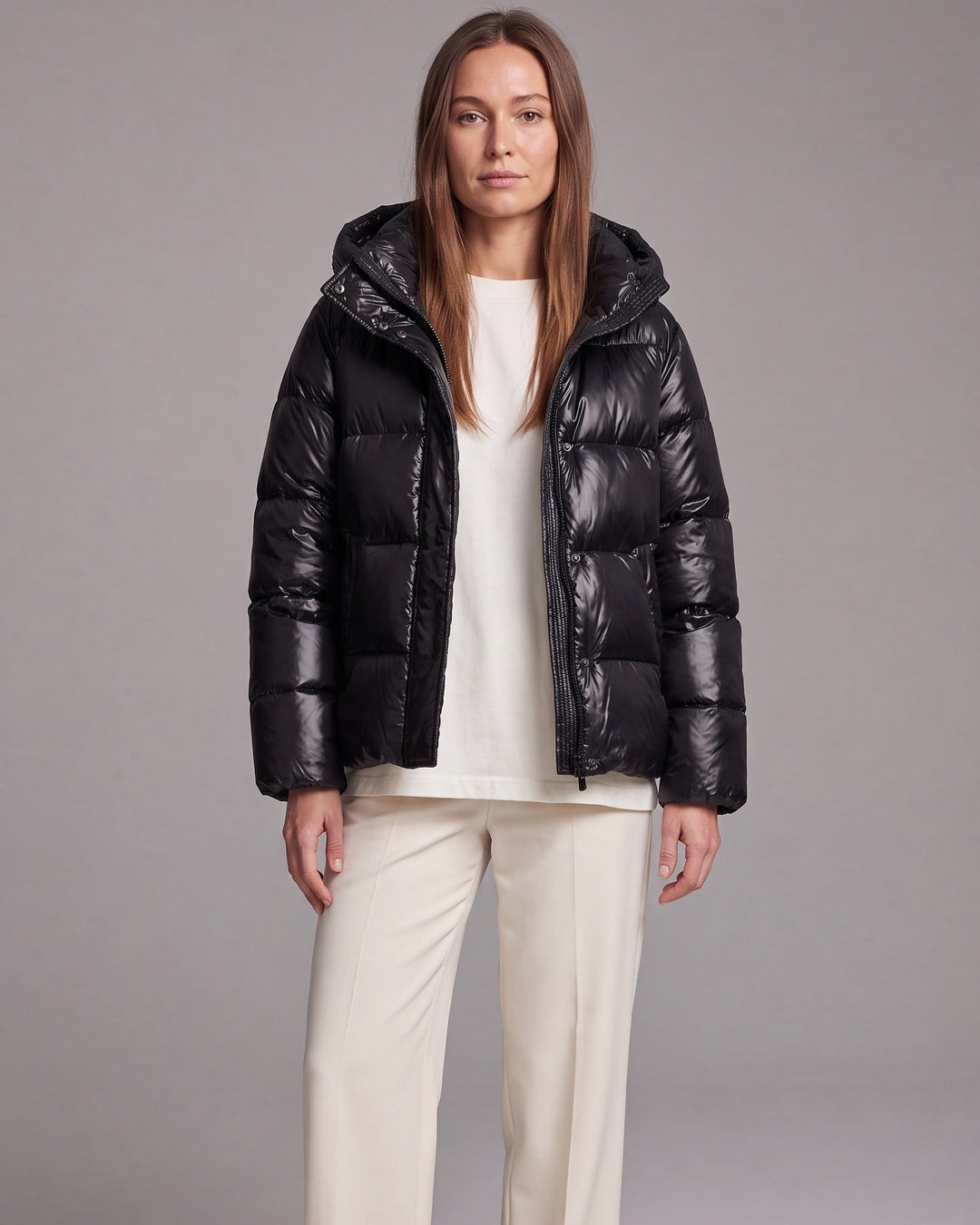 Women's hooded quilted puffer coat with long sleeves and zip front