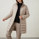Women's quilted jacket with stand collar, long sleeves and zipped pockets