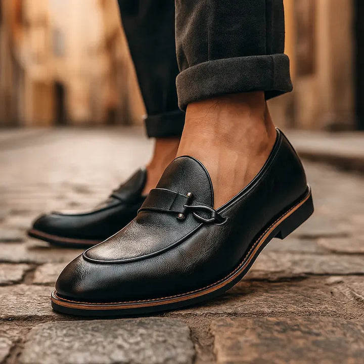Men's slip-on loafers with metal vamp trim and low heels