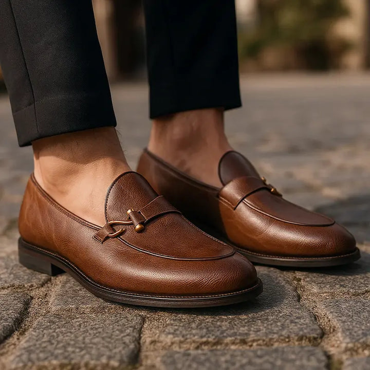 Men's slip-on loafers with metal vamp trim and low heels