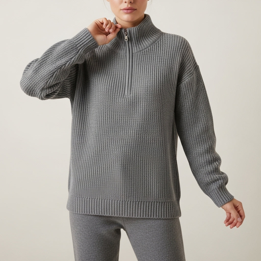 Women's ribbed knit half-zip sweater with high collar and long sleeves