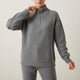 Women's ribbed knit half-zip sweater with high collar and long sleeves