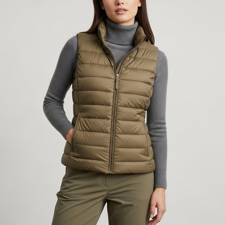 Women's quilted sleeveless puffer vest with stand collar and front zip