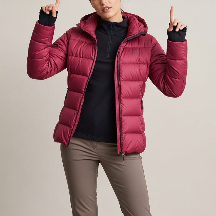 Women's quilted jacket with stand collar, long sleeves and zipped pockets