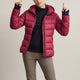 Women's quilted jacket with stand collar, long sleeves and zipped pockets