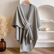 Long tie front poncho scarf with open V-neckline and short cape sleeves