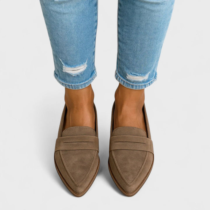 Women's black pointed-toe penny loafers with low heels