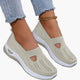 Women's textured slip-on sneakers with front cutout and ridged soles